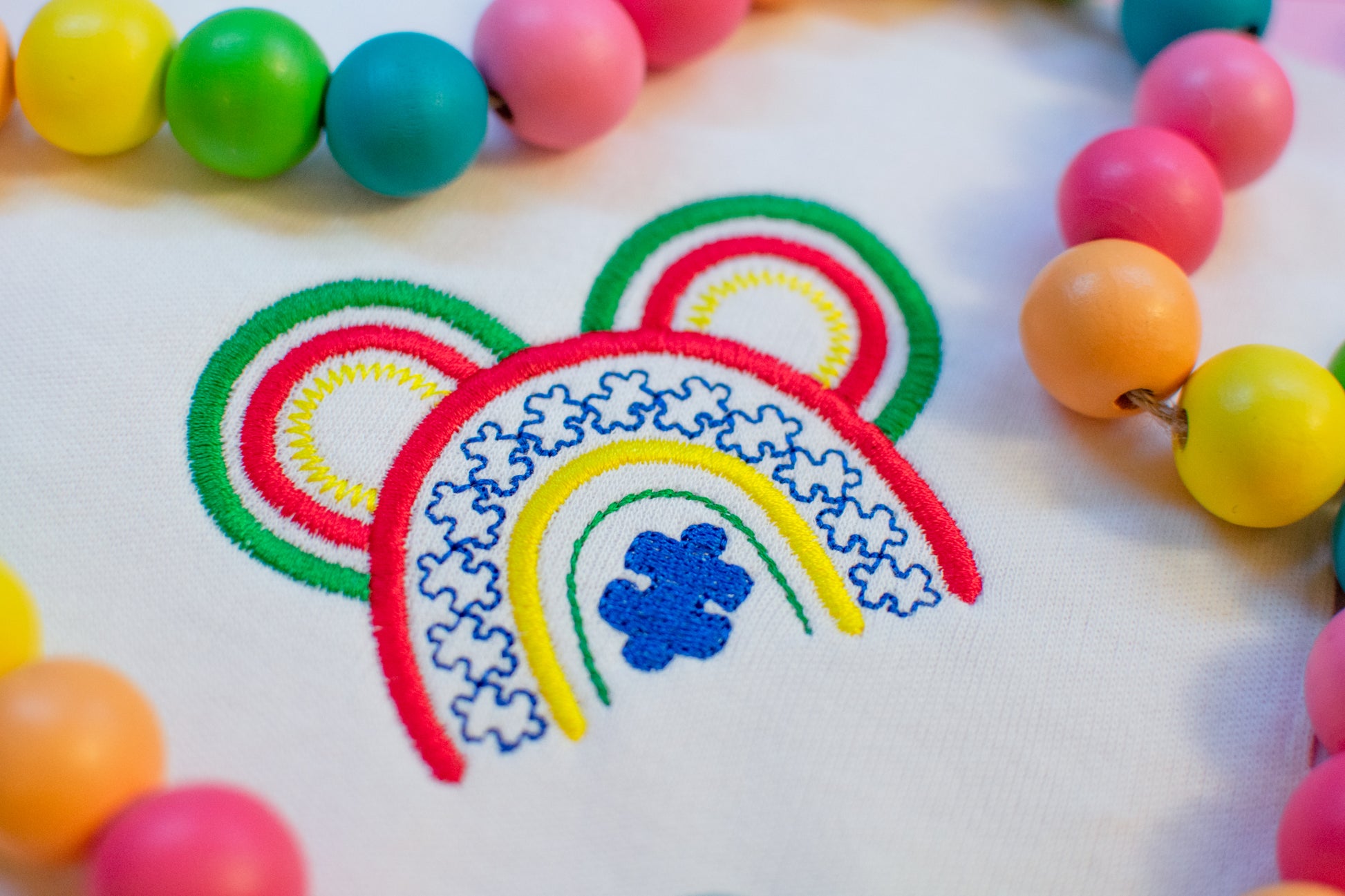 autism awareness rainbow puzzle piece embroidery design